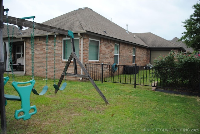 2025 E 134th St S, Bixby, OK 74008 - back of house with brick siding and a shingled roof