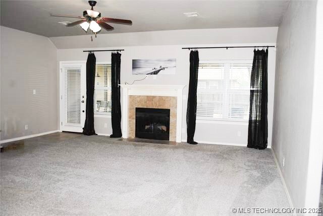 2025 E 134th St S, Bixby, OK 74008 - unfurnished living room featuring ceiling fan and a tile fireplace