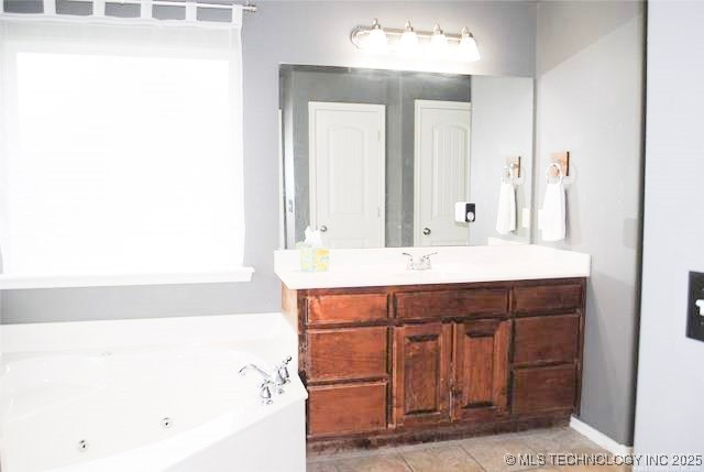 2025 E 134th St S, Bixby, OK 74008 - full bath with vanity, a whirlpool tub, and tile patterned floors