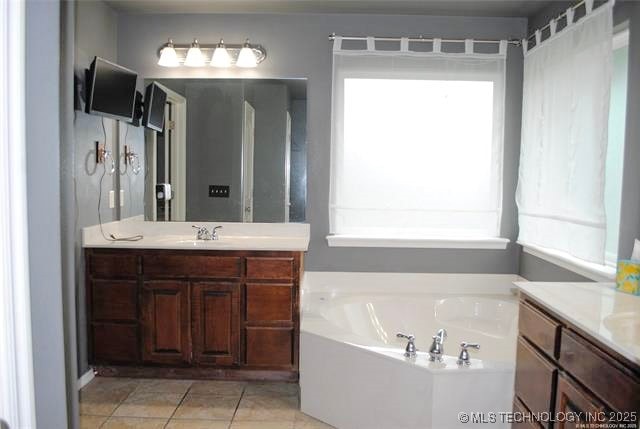 2025 E 134th St S, Bixby, OK 74008 - bathroom with vanity, plenty of natural light, a bath, and tile patterned flooring