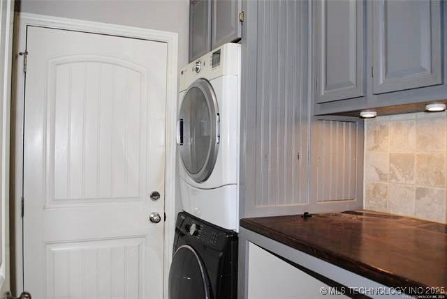 2025 E 134th St S, Bixby, OK 74008 - laundry area with cabinet space and estacked washer and dryer