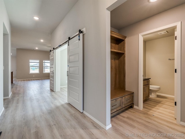 13402 E 124th St, Collinsville, OK 74021 - mudroom with a barn door, light wood-style flooring, recessed lighting, and baseboards
