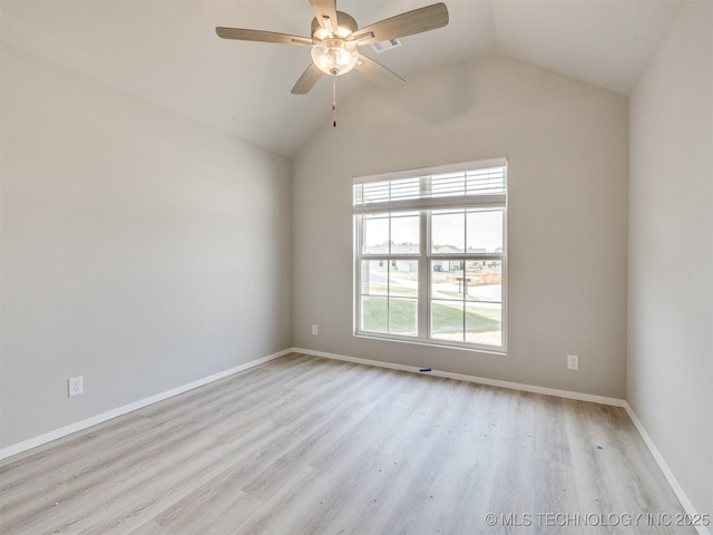 13402 E 124th St, Collinsville, OK 74021 - spare room featuring wood finished floors, vaulted ceiling, ceiling fan, and baseboards
