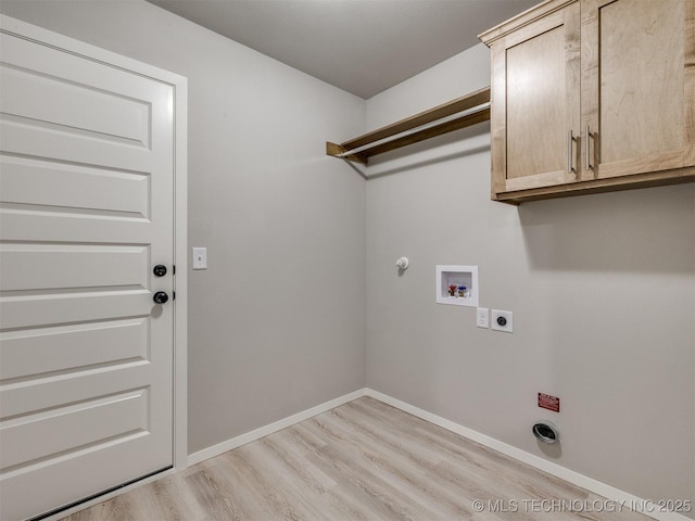 13402 E 124th St, Collinsville, OK 74021 - laundry room featuring electric dryer hookup, cabinet space, washer hookup, light wood-style flooring, and gas dryer hookup