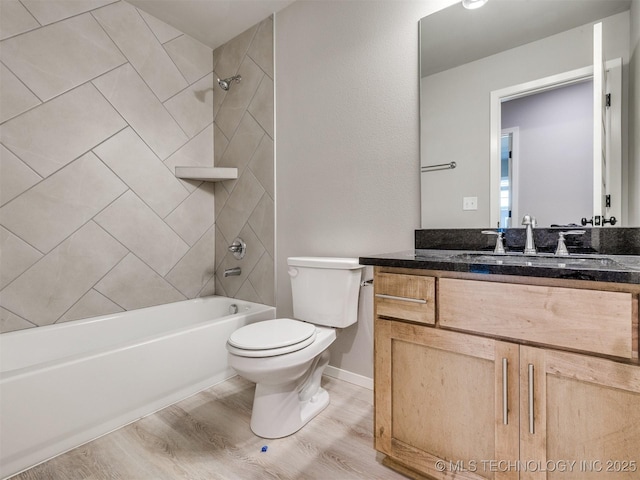 13402 E 124th St, Collinsville, OK 74021 - bathroom featuring wood finished floors, toilet, shower / washtub combination, vanity, and baseboards