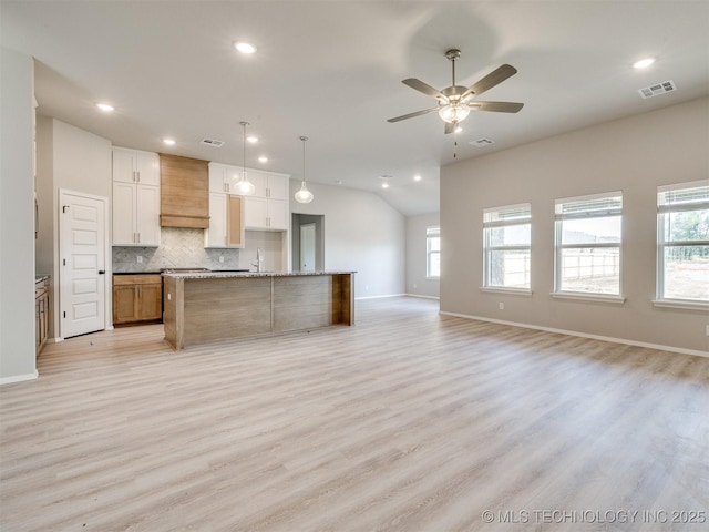 13402 E 124th St, Collinsville, OK 74021 - kitchen with open floor plan, baseboards, plenty of natural light, recessed lighting, and vaulted ceiling