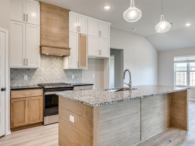 13402 E 124th St, Collinsville, OK 74021 - kitchen featuring stainless steel gas stove, a sink, light wood-type flooring, backsplash, and light stone countertops