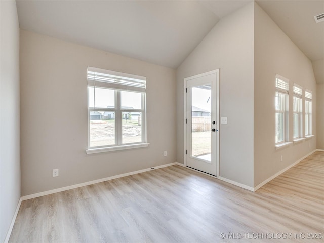 13402 E 124th St, Collinsville, OK 74021 - foyer entrance featuring wood finished floors, vaulted ceiling, and baseboards