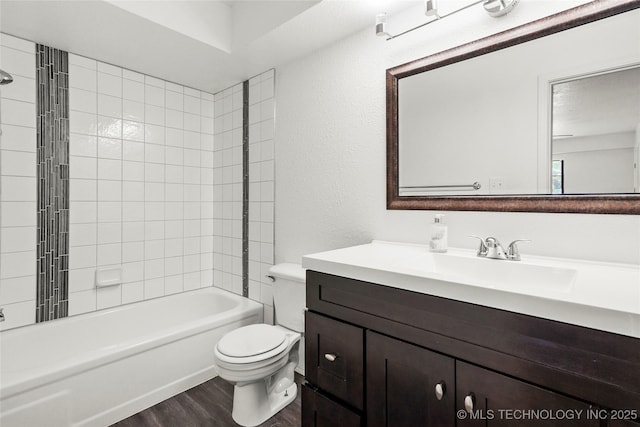7911 E 66th St Unit 45H, Tulsa, OK 74133 - full bathroom with wood finished floors, toilet, vanity, and tub / shower combination