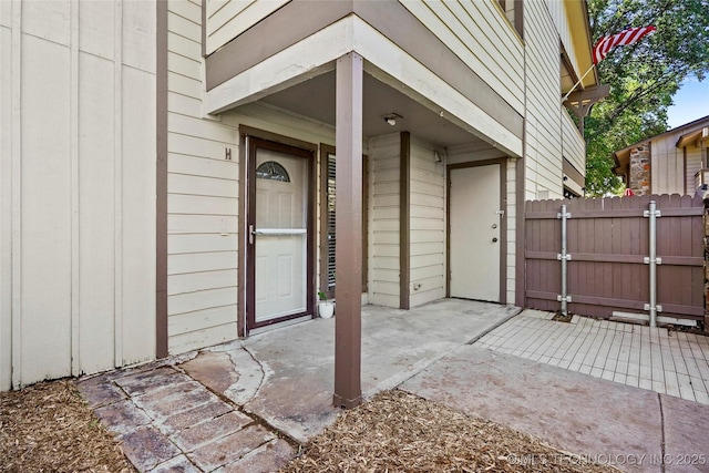 7911 E 66th St Unit 45H, Tulsa, OK 74133 - doorway to property featuring a patio and a gate