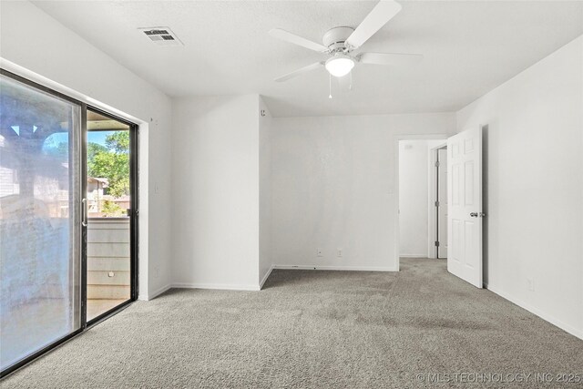 7911 E 66th St Unit 45H, Tulsa, OK 74133 - empty room with carpet, a ceiling fan, and baseboards