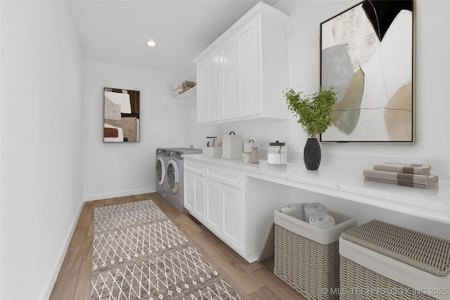 16306 E 102nd St, Owasso, OK 74055 - laundry area with separate washer and dryer, cabinet space, light wood-type flooring, recessed lighting, and baseboards