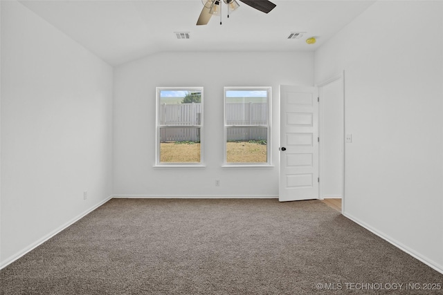 11412 E 93rd Pl, Owasso, OK 74055 - spare room featuring carpet flooring, a ceiling fan, vaulted ceiling, and baseboards