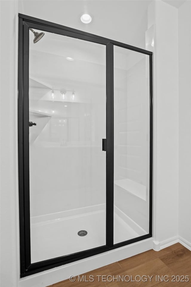 11412 E 93rd Pl, Owasso, OK 74055 - full bath with a stall shower, wood finished floors, and baseboards