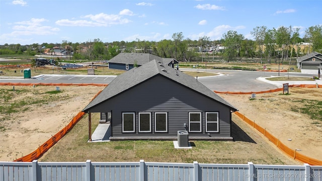 11412 E 93rd Pl, Owasso, OK 74055 - rear view of property with view of wooded area