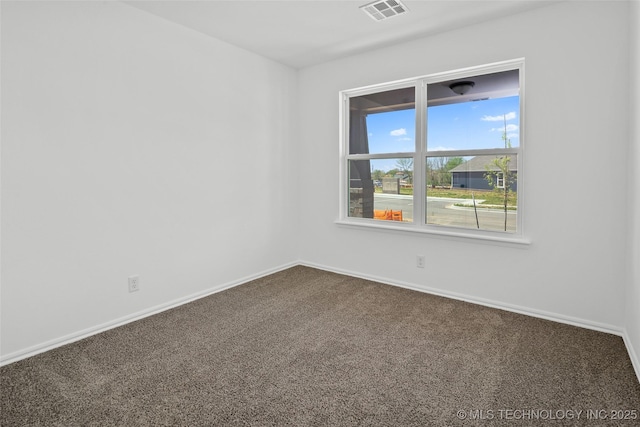 11412 E 93rd Pl, Owasso, OK 74055 - spare room with dark carpet and baseboards