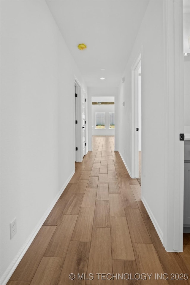 11412 E 93rd Pl, Owasso, OK 74055 - hall featuring wood finished floors and baseboards