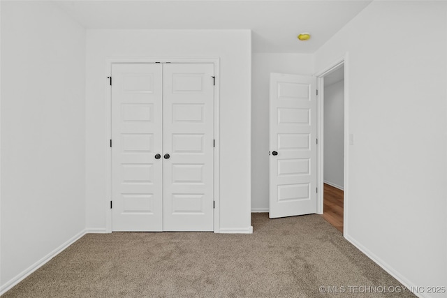 11412 E 93rd Pl, Owasso, OK 74055 - unfurnished bedroom featuring carpet flooring, baseboards, and a closet