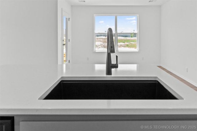 11412 E 93rd Pl, Owasso, OK 74055 - kitchen view of a sink and light countertops