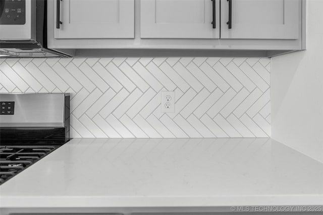 11412 E 93rd Pl, Owasso, OK 74055 - kitchen view of tasteful backsplash and light countertops