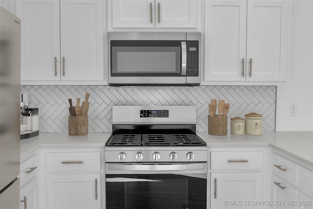 11502 E 94th Pl, Owasso, OK 74055 - kitchen featuring stainless steel appliances, white cabinets, tasteful backsplash, and light countertops
