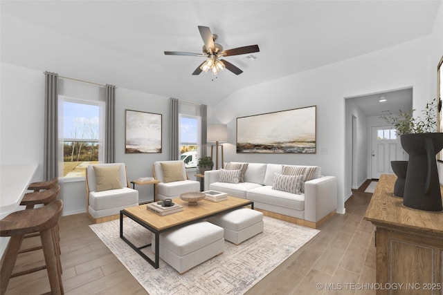 11502 E 94th Pl, Owasso, OK 74055 - living area with a ceiling fan, light wood-style floors, and vaulted ceiling