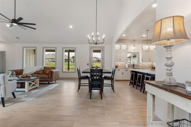 18258 S Clear Creek Ct, Claremore, OK 74017 - dining area with recessed lighting, a chandelier, ceiling fan, high vaulted ceiling, and light wood-type flooring