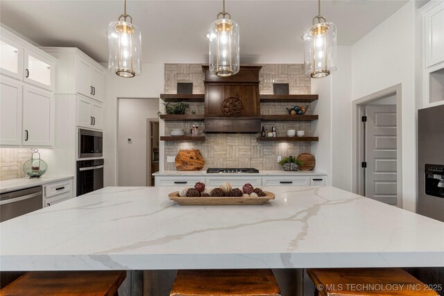 18258 S Clear Creek Ct, Claremore, OK 74017 - kitchen with open shelves, stainless steel appliances, a center island, and tasteful backsplash