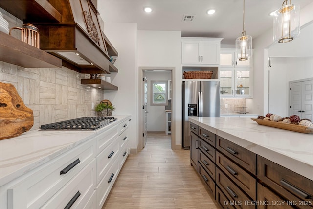 18258 S Clear Creek Ct, Claremore, OK 74017 - kitchen featuring open shelves, appliances with stainless steel finishes, tasteful backsplash, white cabinets, and light stone counters