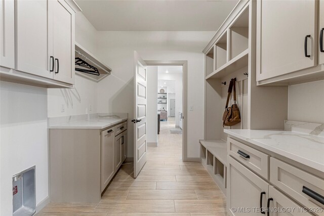 18258 S Clear Creek Ct, Claremore, OK 74017 - mudroom featuring light wood-style floors and baseboards