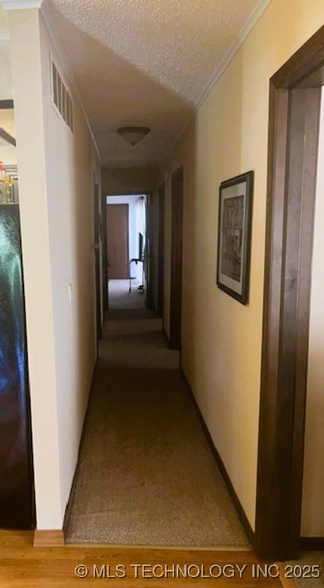 1417 Leisure Rd, Grove, OK 74344 - hall with a textured ceiling and crown molding