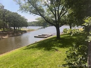 1417 Leisure Rd, Grove, OK 74344 - exterior space featuring a water view and a lawn