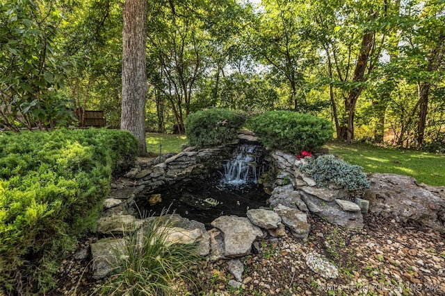 10942 S 93rd E Ave, Bixby, OK 74133 - view of yard with fence and a garden pond