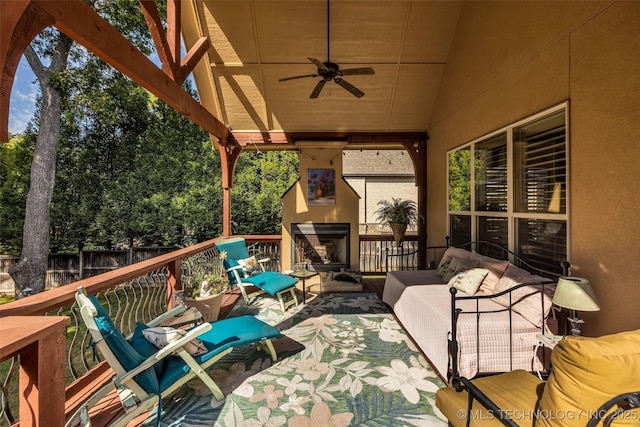 10942 S 93rd E Ave, Bixby, OK 74133 - wooden terrace with an outdoor living space with a fireplace, fence, and ceiling fan