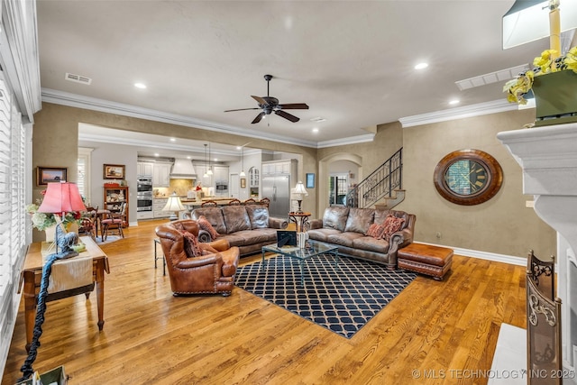 10942 S 93rd E Ave, Bixby, OK 74133 - living room featuring ceiling fan, light wood-style floors, stairs, crown molding, and recessed lighting