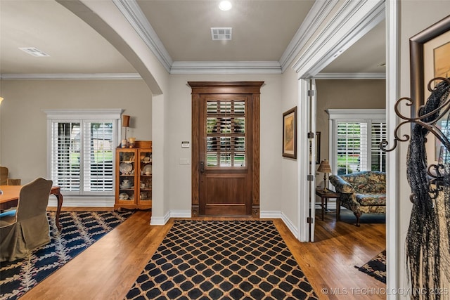 10942 S 93rd E Ave, Bixby, OK 74133 - entryway featuring arched walkways, wood finished floors, ornamental molding, and baseboards