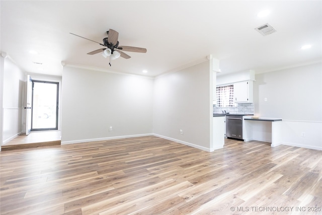 unfurnished living room with a ceiling fan, ornamental molding, light wood-type flooring, baseboards, and recessed lighting
