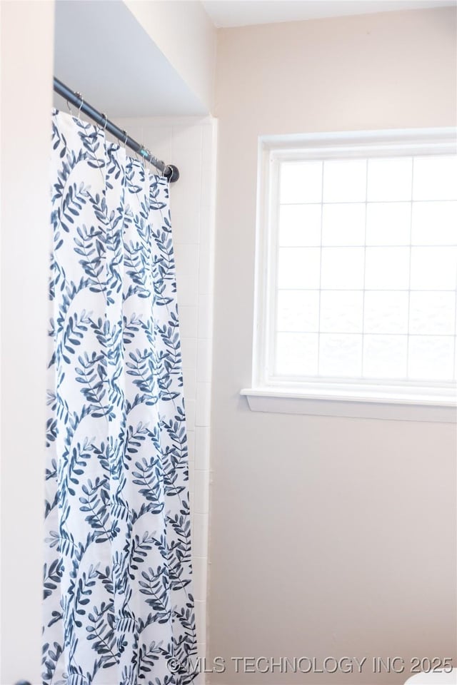 bathroom with a shower with shower curtain