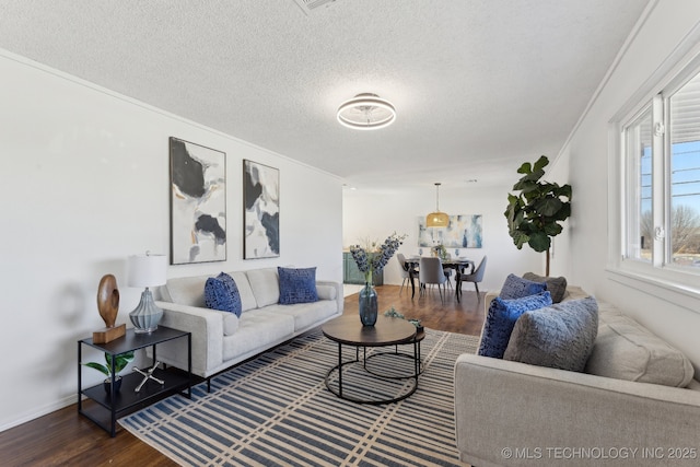 523 W Toledo Pl, Broken Arrow, OK 74012 - living room featuring wood finished floors, crown molding, a textured ceiling, and baseboards