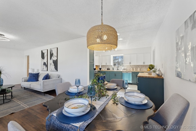 523 W Toledo Pl, Broken Arrow, OK 74012 - dining space with a textured ceiling and wood finished floors