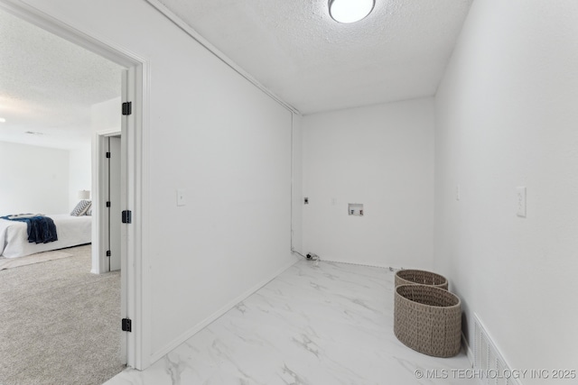 523 W Toledo Pl, Broken Arrow, OK 74012 - laundry room featuring a textured ceiling, hookup for a washing machine, and marble look tile flooring