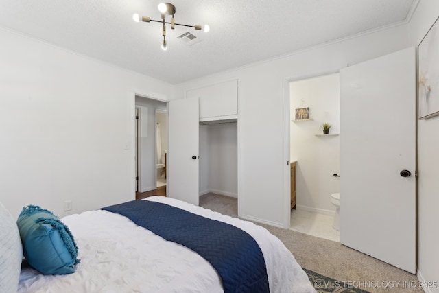 523 W Toledo Pl, Broken Arrow, OK 74012 - bedroom with light colored carpet, crown molding, a textured ceiling, and connected bathroom