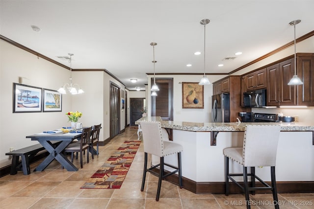 25 Grand Lake Dr Unit 3B, Afton, OK 74331 - kitchen featuring fridge, black microwave, ornamental molding, a kitchen breakfast bar, and dark brown cabinetry