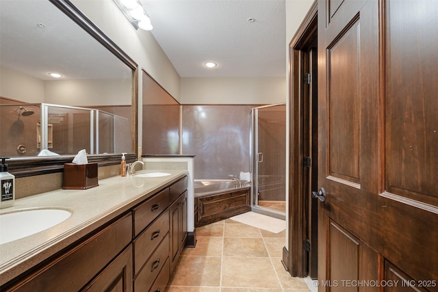 25 Grand Lake Dr Unit 3B, Afton, OK 74331 - full bathroom with a stall shower, a garden tub, double vanity, and tile patterned flooring