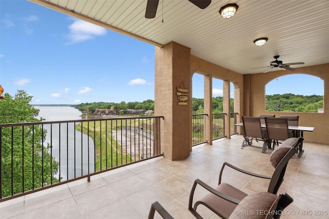 25 Grand Lake Dr Unit 3B, Afton, OK 74331 - view of patio featuring ceiling fan, a water view, outdoor dining space, and a balcony