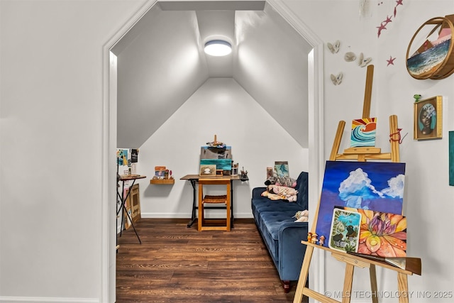 sitting room with wood finished floors and lofted ceiling