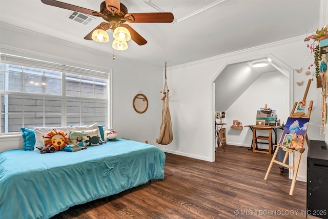 bedroom with wood finished floors, ornamental molding, baseboards, and a ceiling fan