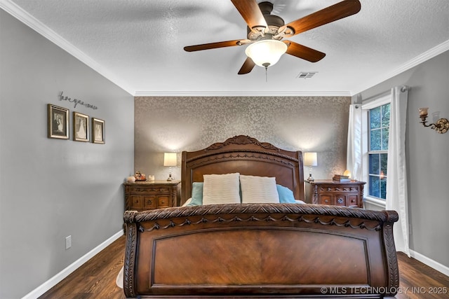 bedroom with a textured ceiling, dark wood-style flooring, crown molding, baseboards, and ceiling fan