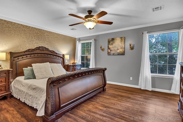 bedroom with wood finished floors, baseboards, crown molding, and a ceiling fan