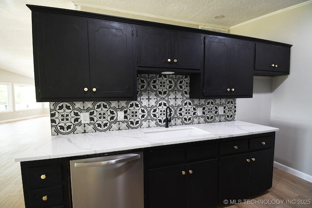 96358 S 4531, Vian, OK 74962 - kitchen featuring stainless steel dishwasher, a sink, dark cabinetry, wood finished floors, and a textured ceiling